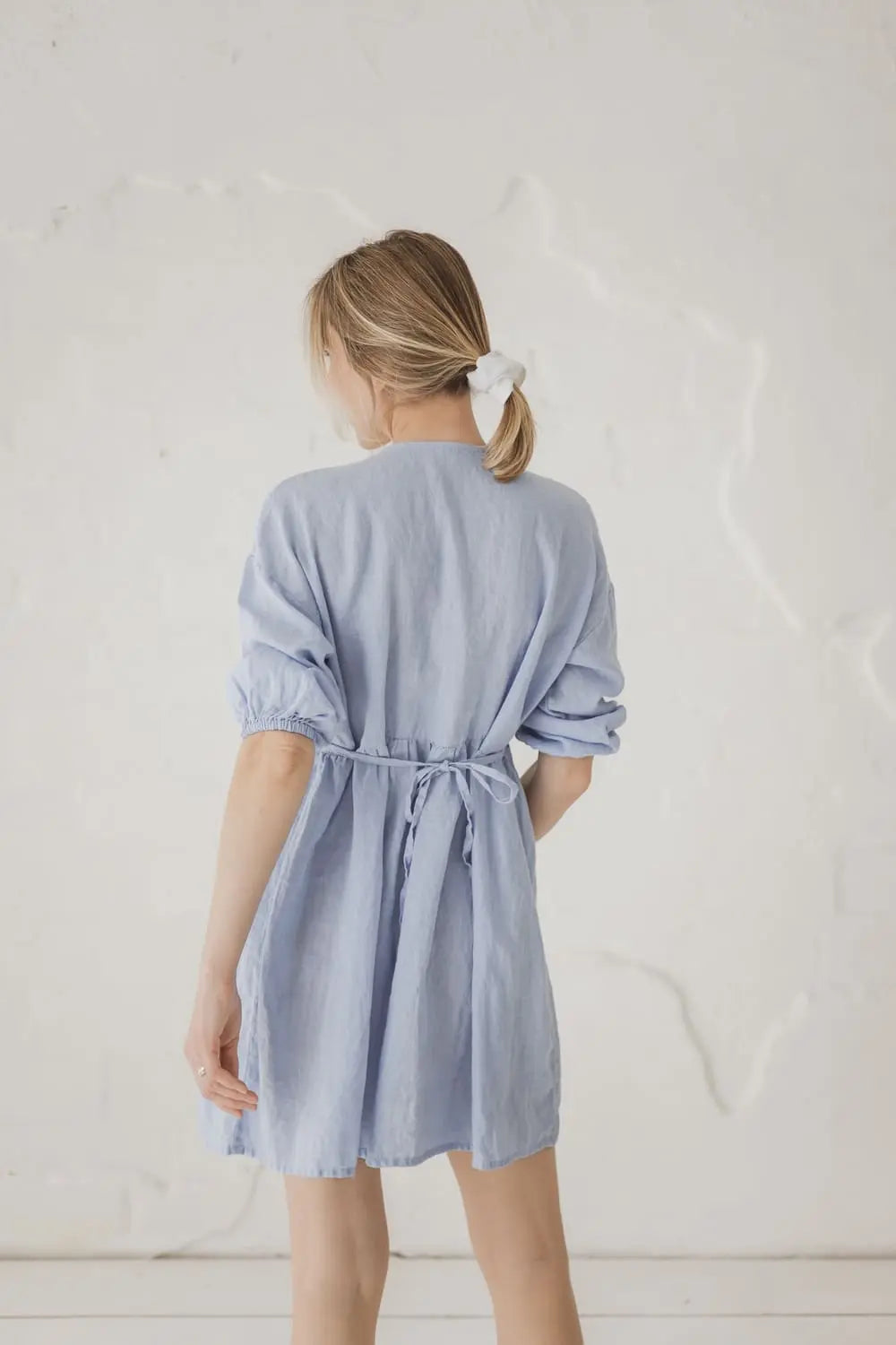 Linen Gathered Waist Mini Dress — back view with gathered waist tie
