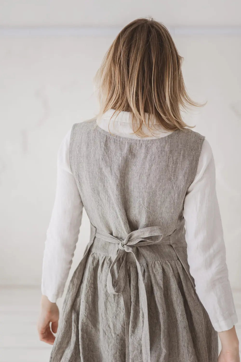 Convertible Linen Pinafore Dress back view walking - Epic Linen