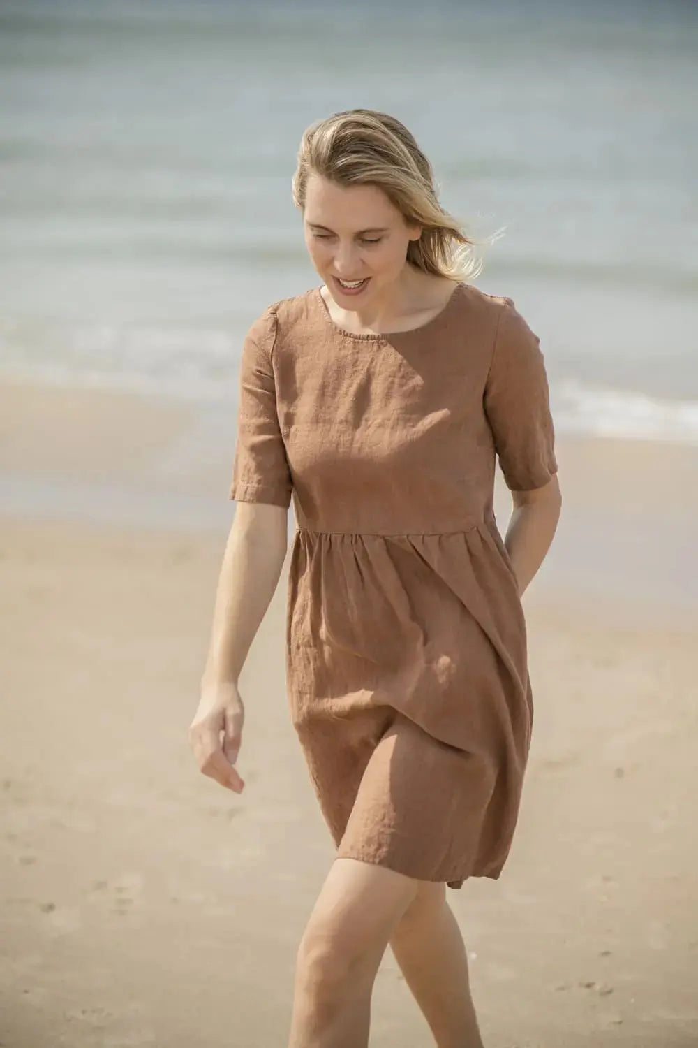 Linen Dress with Pockets, front view, walking on the beach